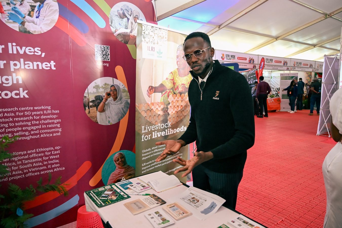 Saleef Nyambok presenting at the ILRI exhibition booth