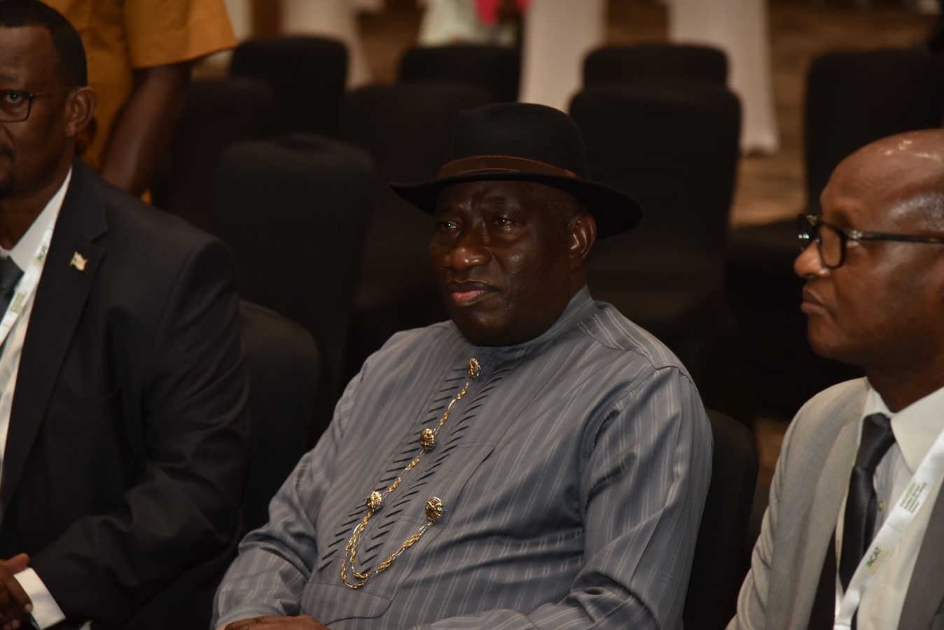 Delegate seated in a conference plenary