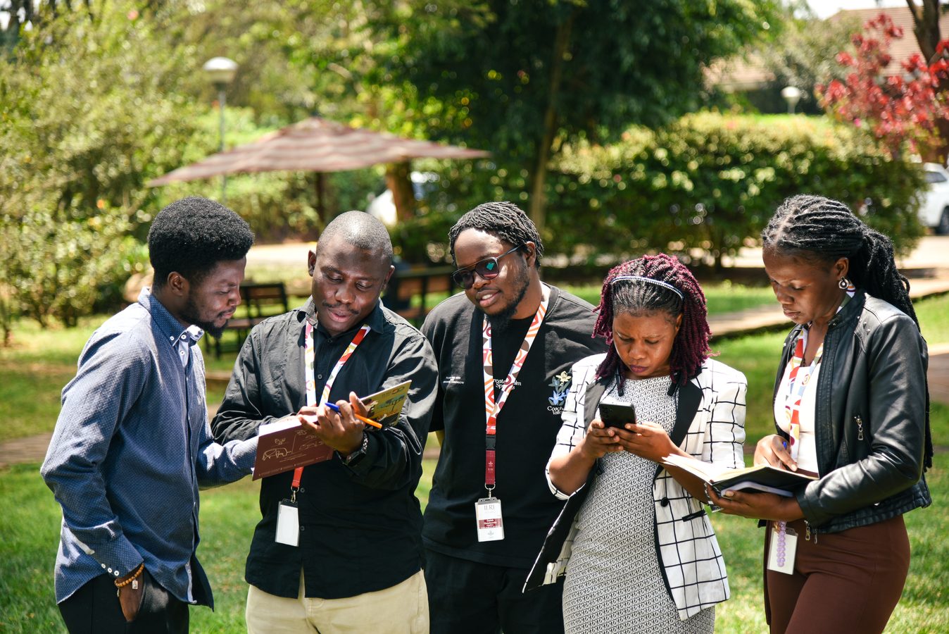 Delegates checking phones and notebooks between sessions