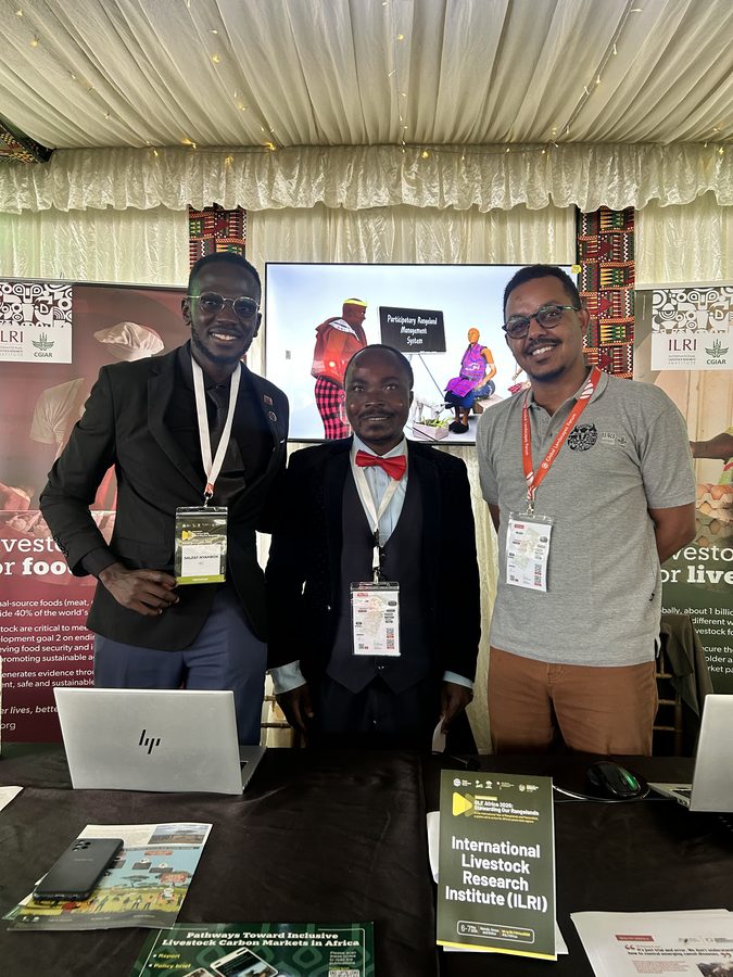 Saleef Nyambok with colleagues at the ILRI exhibition stand